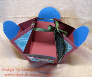 This box is made by scoring the 12" paper at 4" and 8" on each side and pulling the corners up with ribbon.