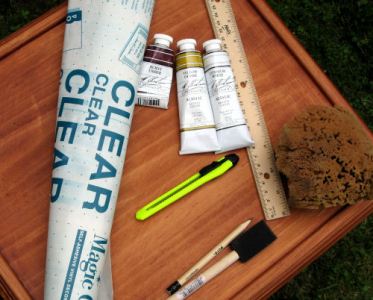 Supplies: Contact Paper, Acrylic Paint (M Graham & Co,), Craft knife, sea sponge, foam brush, ruler, pencil, Other: Painter's or masking tape, scissors and a feather or fine brush.