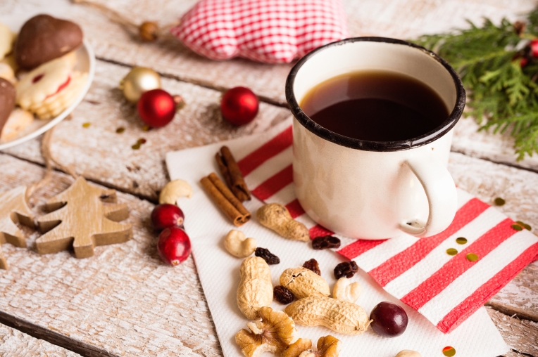 graphicstock-christmas-composition-cup-of-coffee-dried-fruit-cranberries-and-nuts-various-objects-laid-on-table-studio-shot-wooden-background_Buu7mQhBz-.jpg